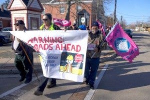 Members of the Nova Scotia Highway Workers' Union (CUPE Local 1867) marched in downtown Middleton today to protest what they say are the Liberal government's plans to shut down the province's new asphalt plant. They started at Premier Stephen McNeil's Middleton constituency office. When they discovered it was closed, they walked through the town handing out flyers.